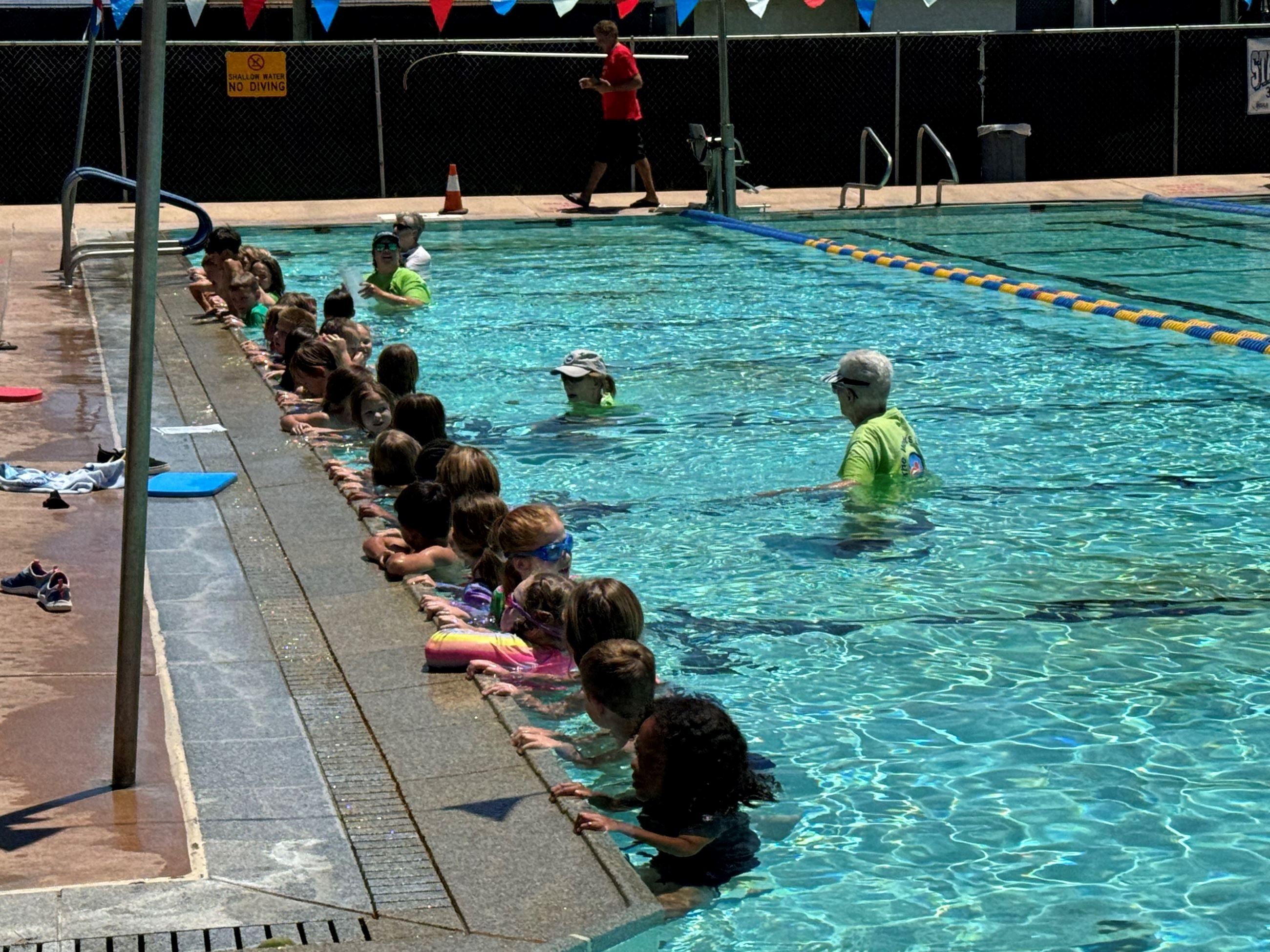 people in the Boulder City pool taking part in  the Worlds Largest Swimming Lesson in 2024.