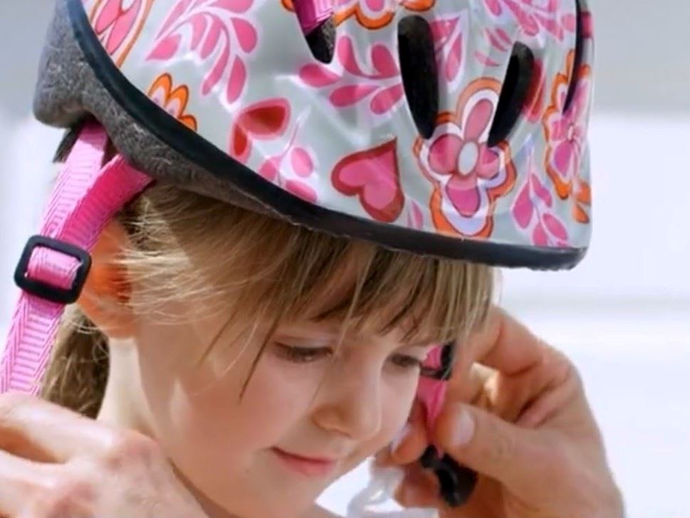 bike, little girl with a helmet, wheels of a scooter